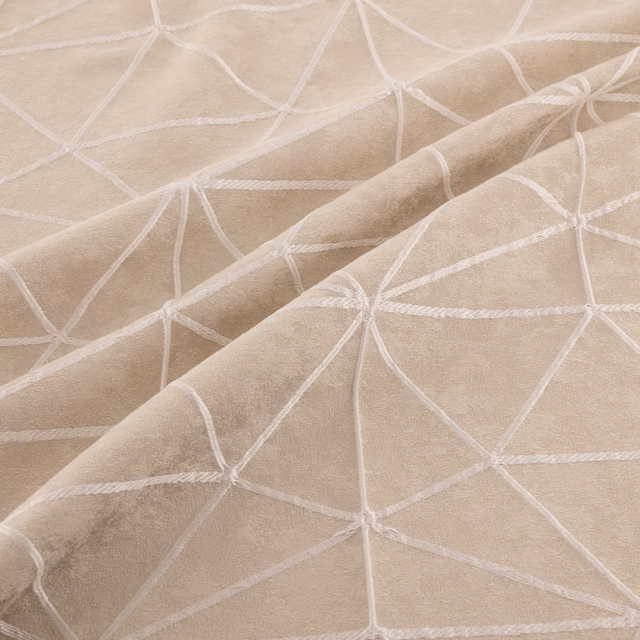 Warm beige fabric with raised ivory lines forming an irregular geometric network