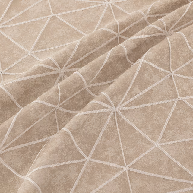 Taupe-beige fabric with raised ivory lines forming an irregular geometric network