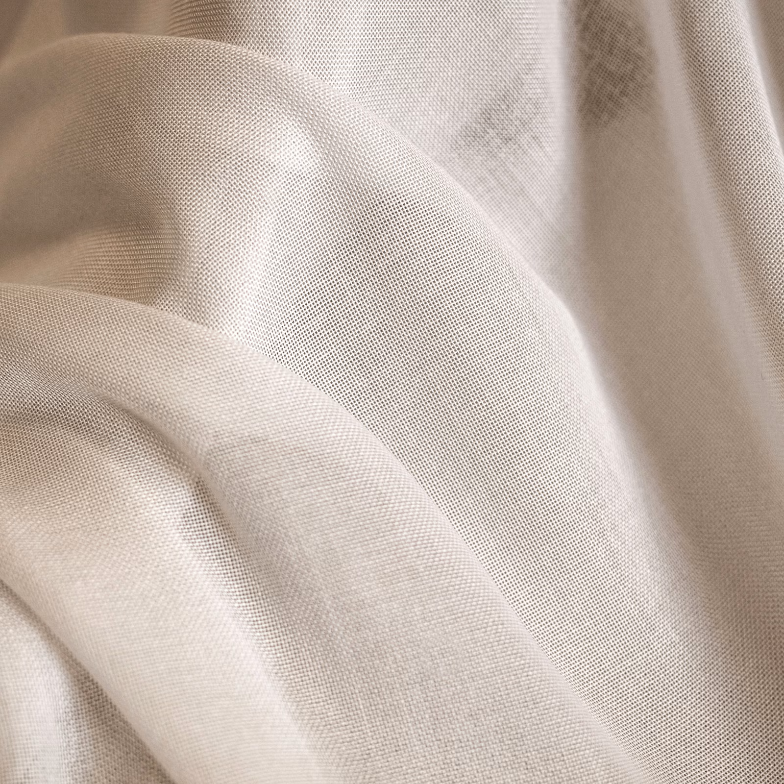 Warm cream finely woven fabric draped in soft folds with a subtle ivory sheen