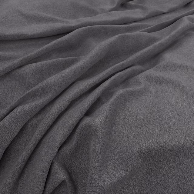 Draped smoky graphite grey fabric showing a fine pebbled texture and soft folds