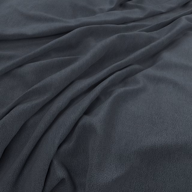 Deep blue-grey plain fabric with a softly brushed texture falling in flowing folds