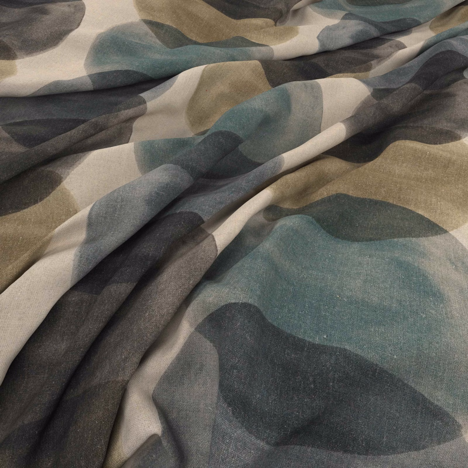 Jade, charcoal and taupe abstract forms across softly folded woven fabric