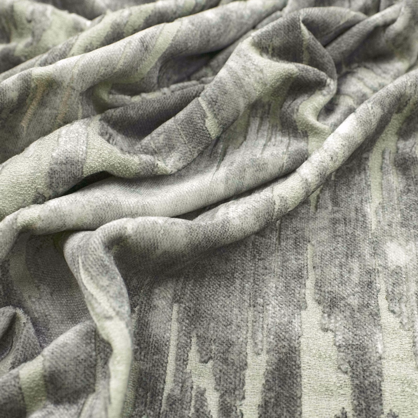 Cool basalt-grey textile with pale vertical painterly striations gathered into soft folds