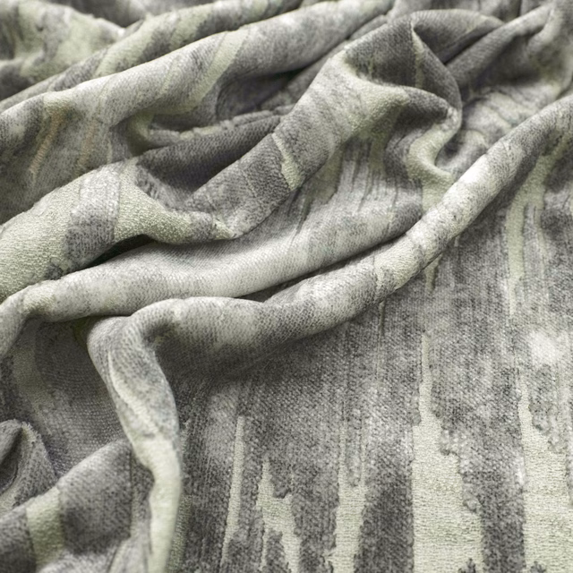 Cool basalt-grey textile with pale vertical painterly striations gathered into soft folds