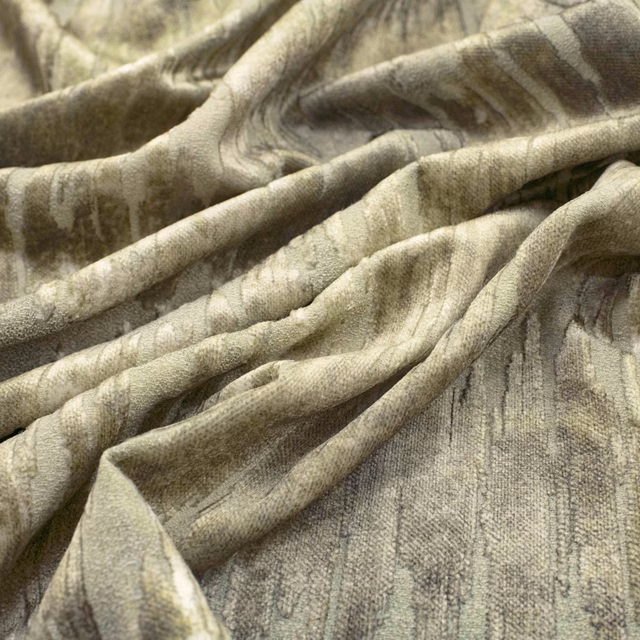 Muted olive fabric with cloudy striations and a softly napped, folded surface