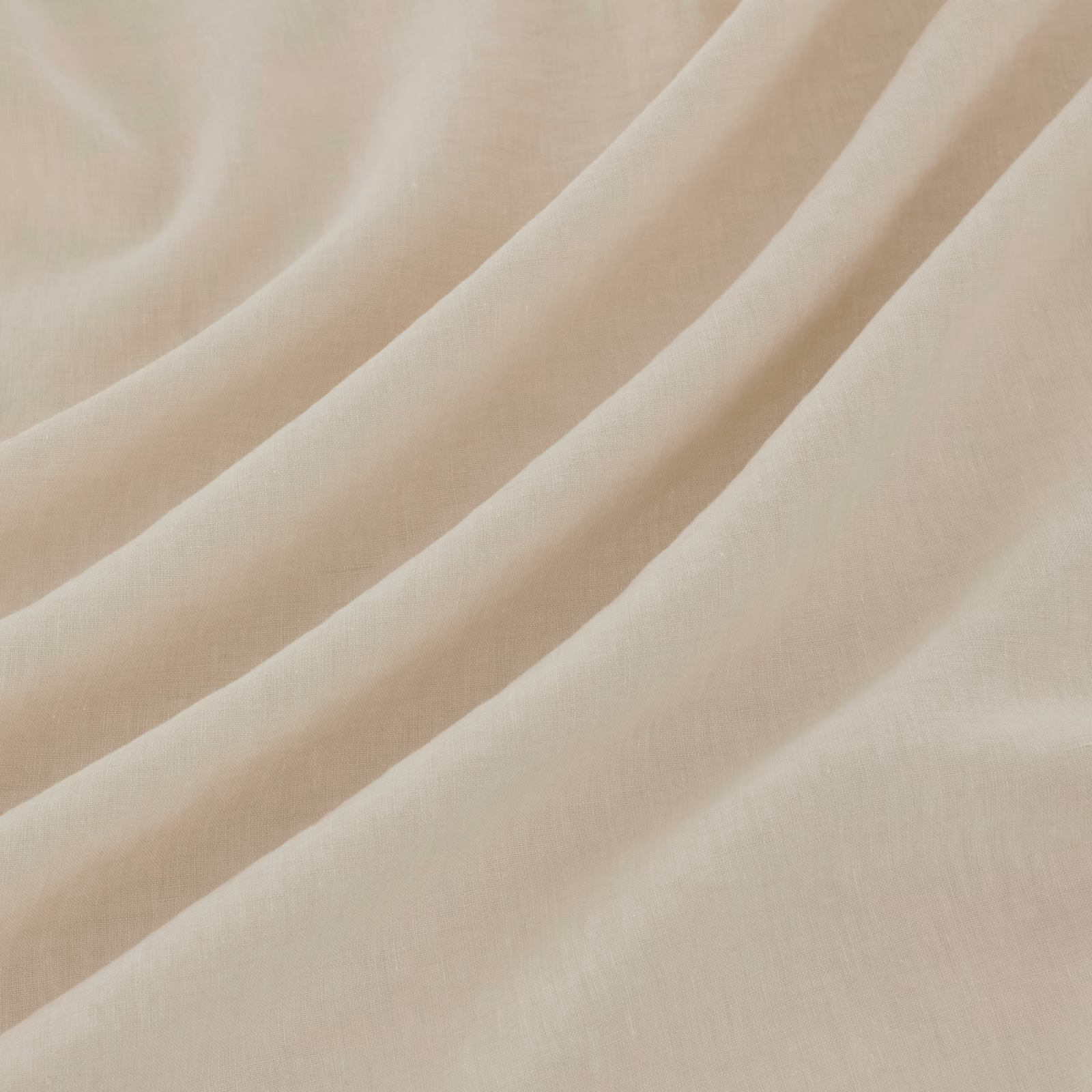 Pale chalk-cream fabric with fine weave, shown in soft diagonal folds