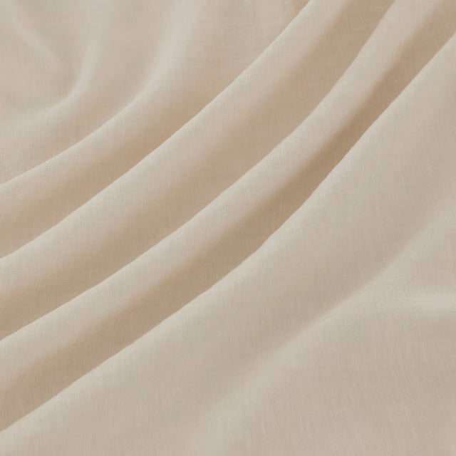 Pale chalk-cream fabric with fine weave, shown in soft diagonal folds
