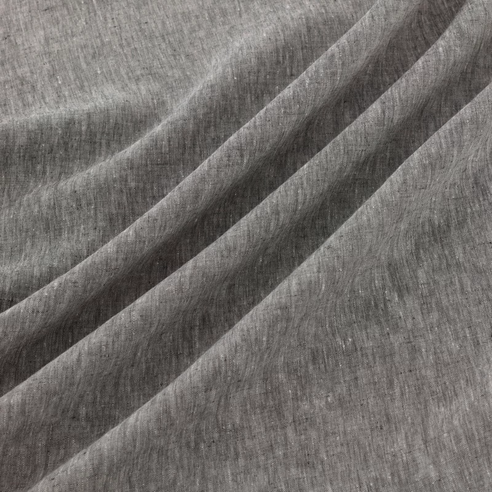Deep ink-grey woven texture with vertical striations and diagonal folds