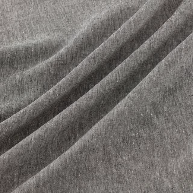 Deep ink-grey woven texture with vertical striations and diagonal folds