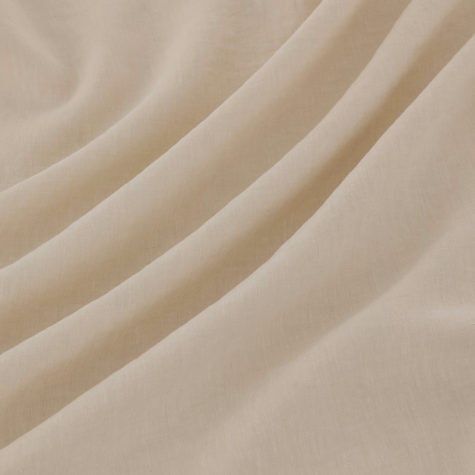 Pale milk-ivory Pesaro fabric with fine weave, shown in soft flowing folds