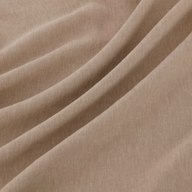 Dusty petal-pink plain weave fabric gathered into softly rounded folds