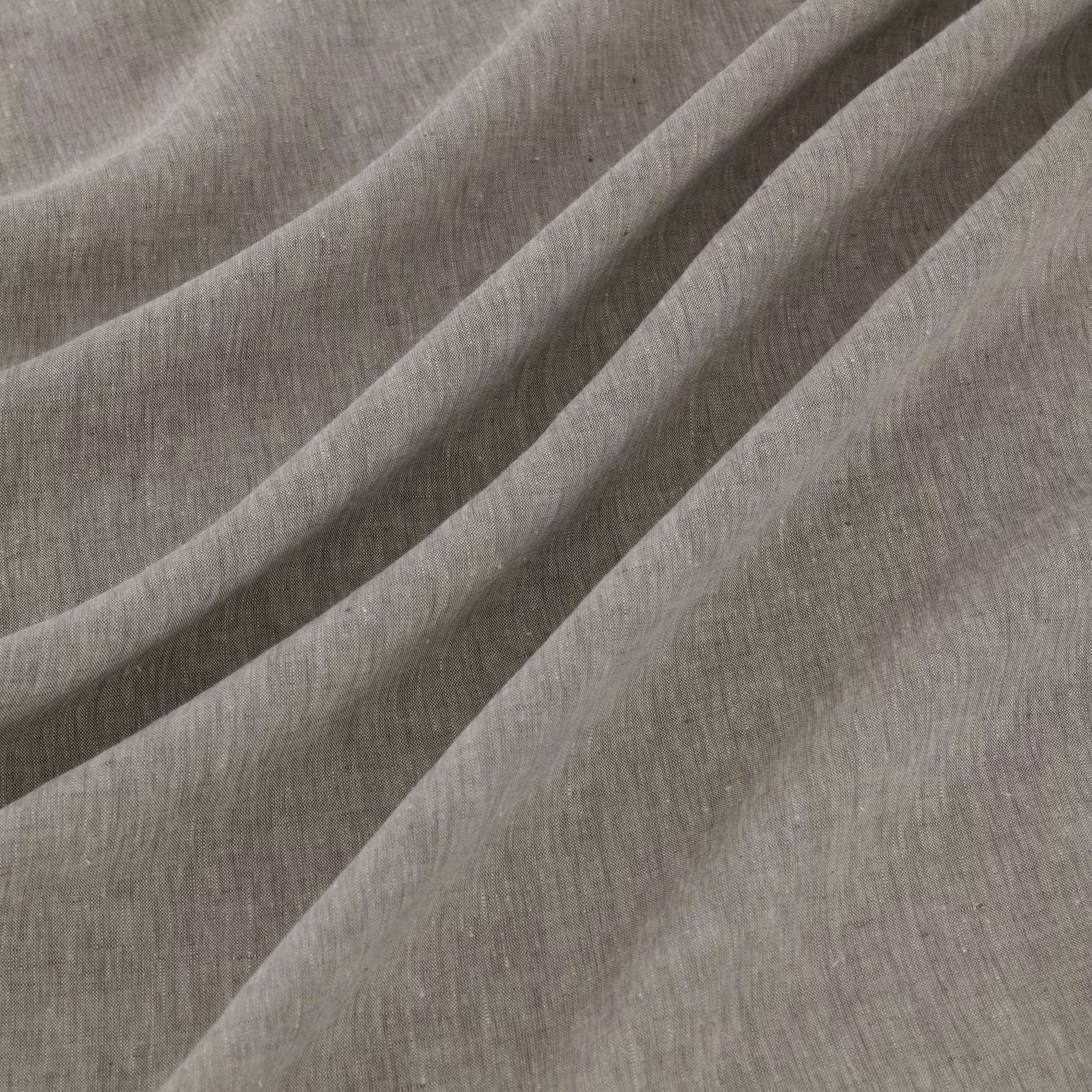 Close-up of taupe-grey plain weave falling into soft diagonal folds