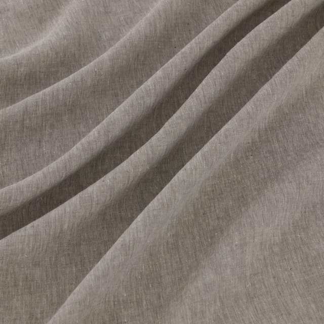 Close-up of taupe-grey plain weave falling into soft diagonal folds
