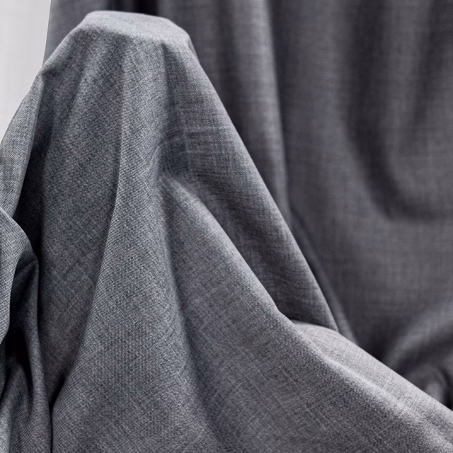 Charcoal-grey Pireas fabric with fine crosshatched weave and softly folded texture