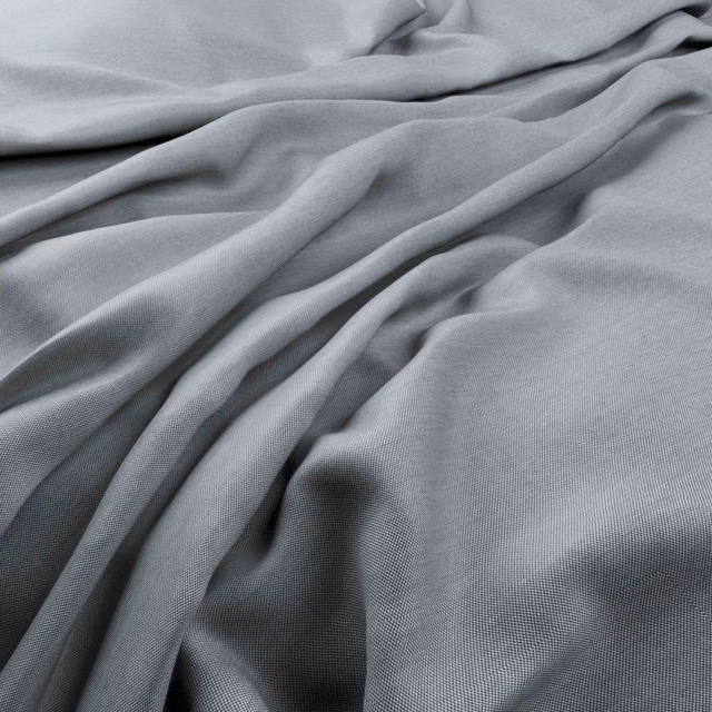 Cool blue-grey Playa Horizon fabric in fluid folds with a fine woven texture