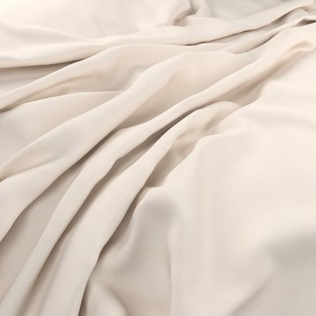 Cool ivory fabric with fine texture falling in soft, fluid folds