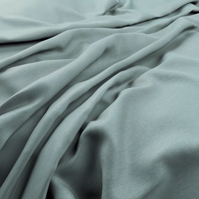 Pale lagoon blue-green fabric draped in fluid folds with a fine woven texture