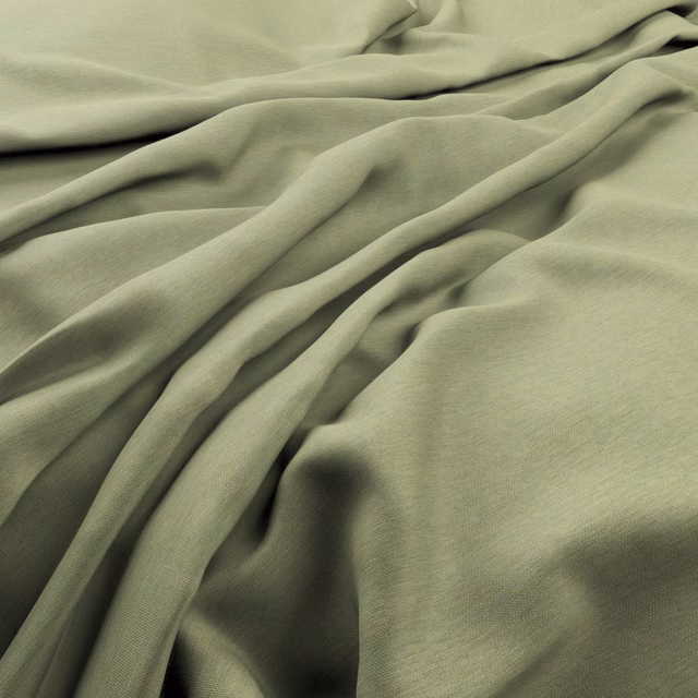 Muted sage-lime fabric with fine weave draped into softly shadowed folds