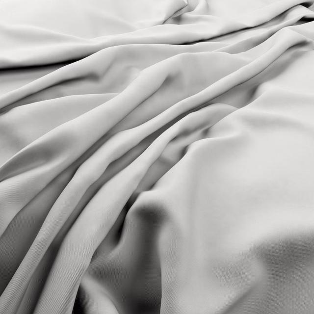 Pale oyster-grey fabric in soft fluid folds with a fine, smooth surface