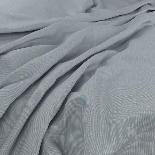 Pale blue-grey fine-weave fabric gathered into soft flowing folds