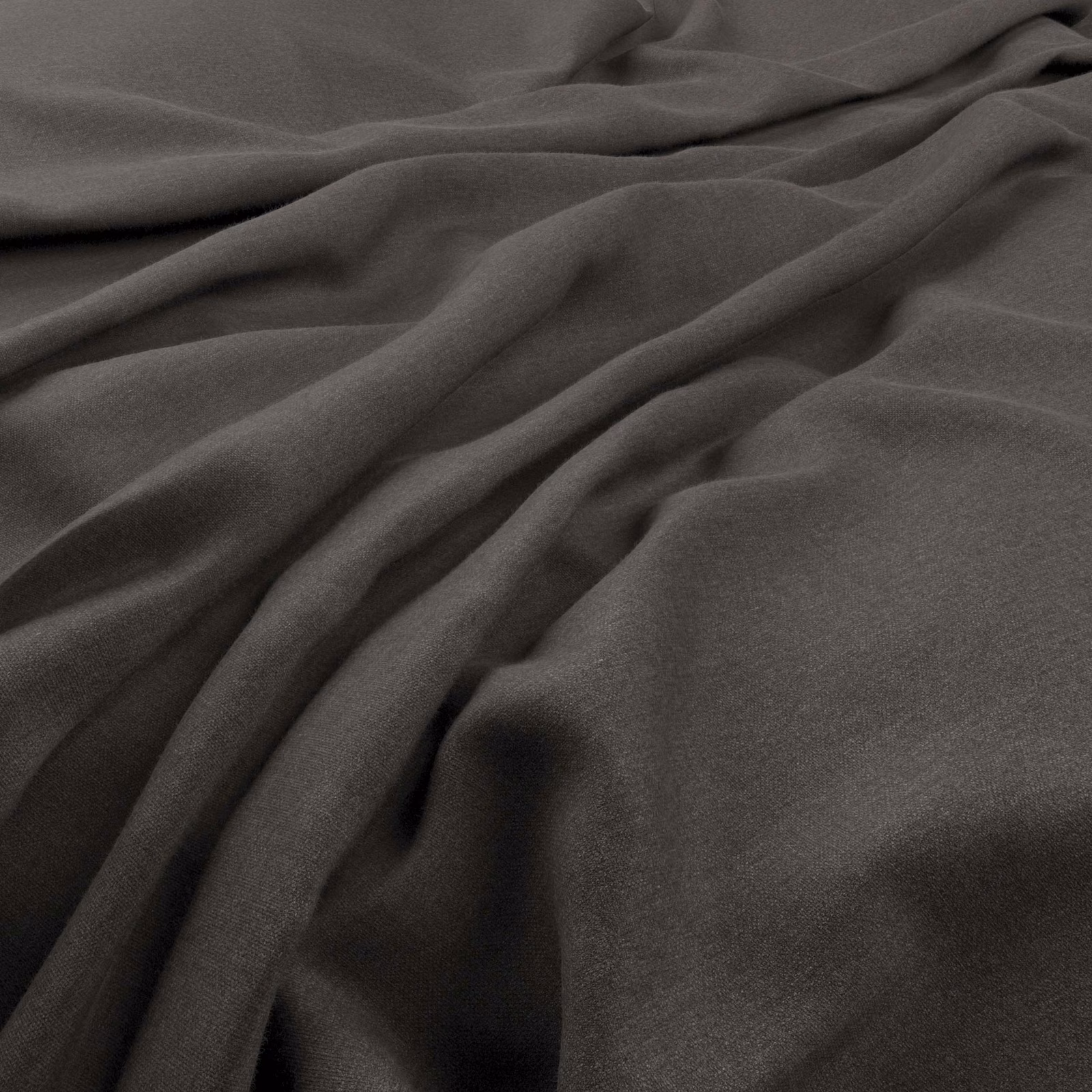 Deep charcoal-grey plain fabric falling in soft, fluid folds with a fine texture