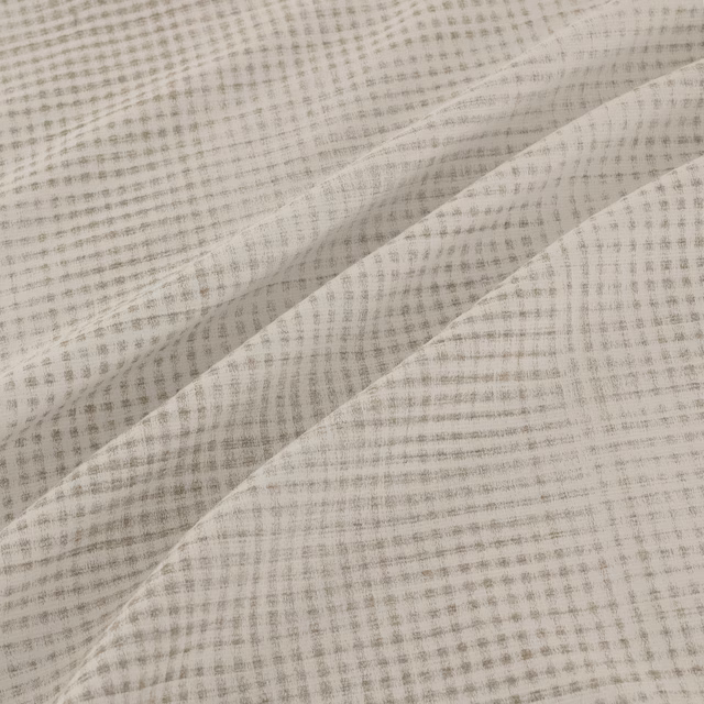 Pale platinum-grey woven fabric with a fine, irregular checked texture and soft folded highlights