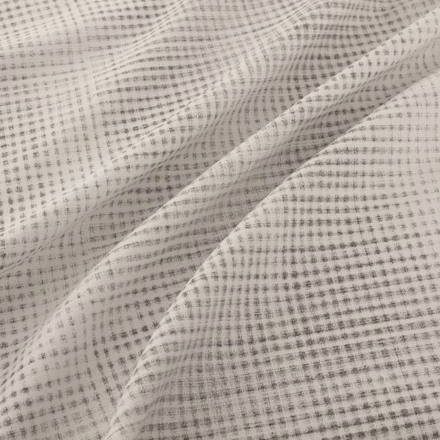 Cool steel-grey woven check with fine ivory lines and softly folded texture