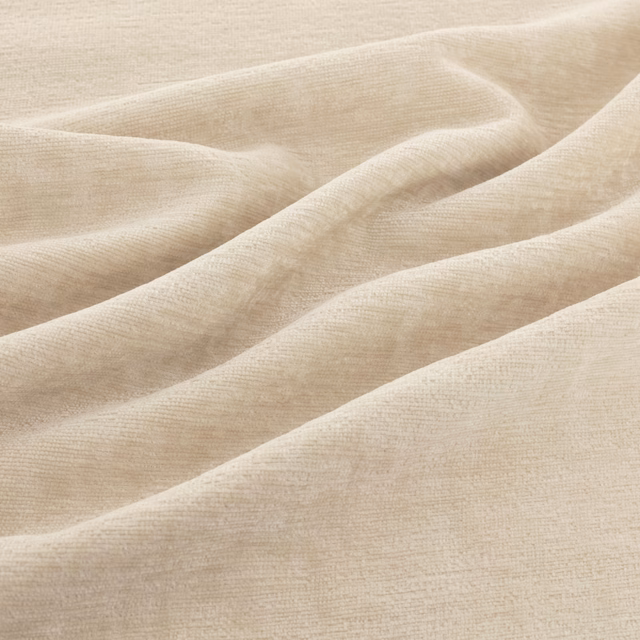 Pale ivory-beige woven fabric with fine horizontal texture gathered into soft flowing folds