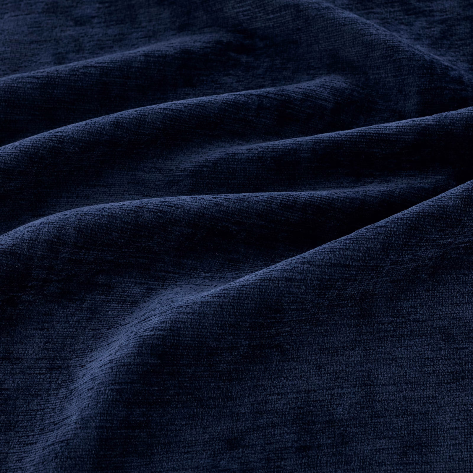 Deep ink-navy plush fabric with directional pile and soft blue highlights