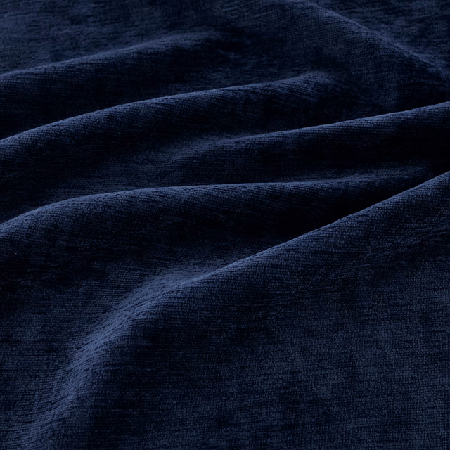 Deep ink-navy plush fabric with directional pile and soft blue highlights
