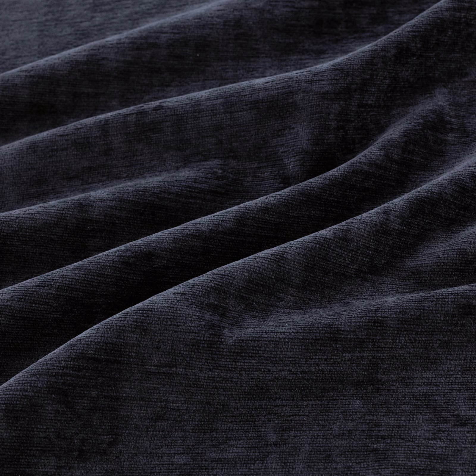 Midnight blue-black velvet with plush pile and cool highlights across folded fabric