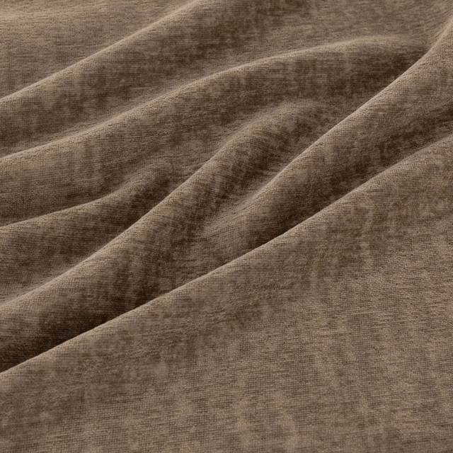 Warm nutmeg-brown fabric in broad folds, showing softly brushed directional texture