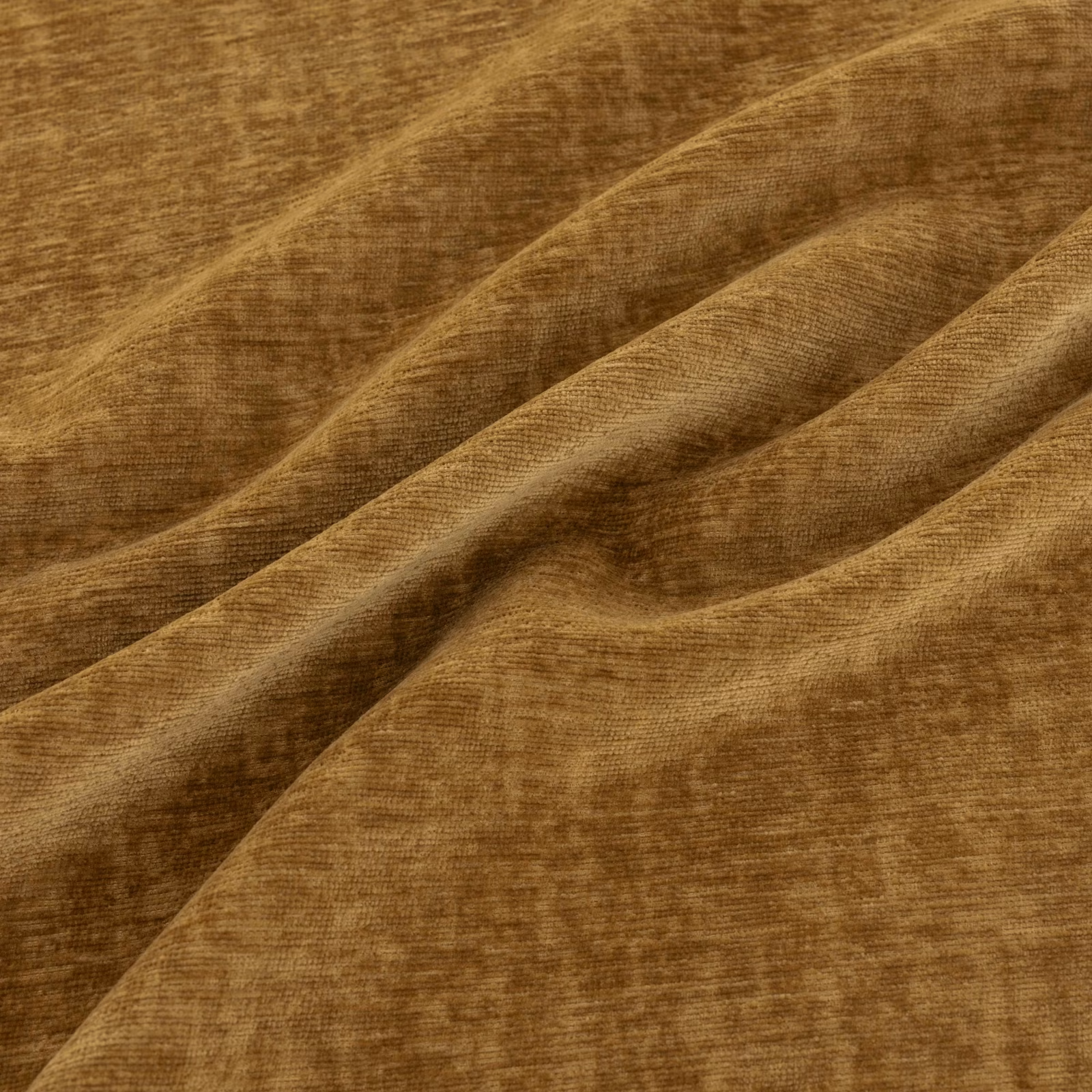 Warm saffron-ochre fabric with plush directional pile and caramel-brown shading