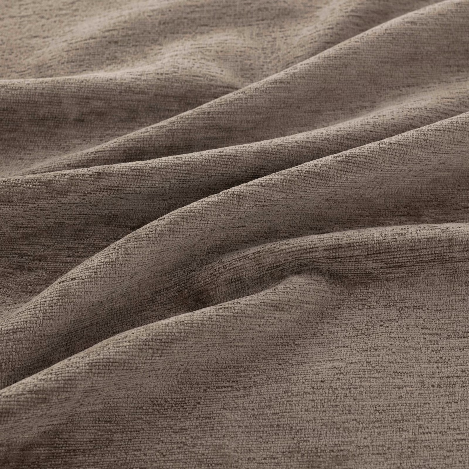 Warm truffle-brown crosshatched weave gathered into softly lit, deep fabric folds