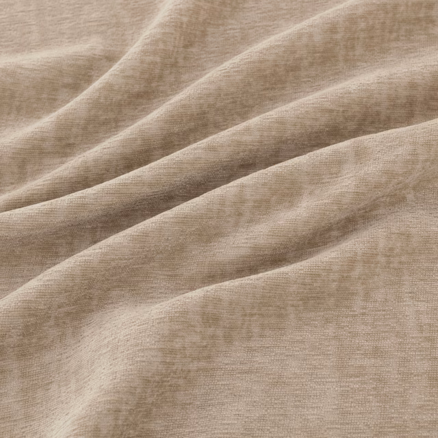 Warm taupe finely woven fabric gathered into soft, fluid folds