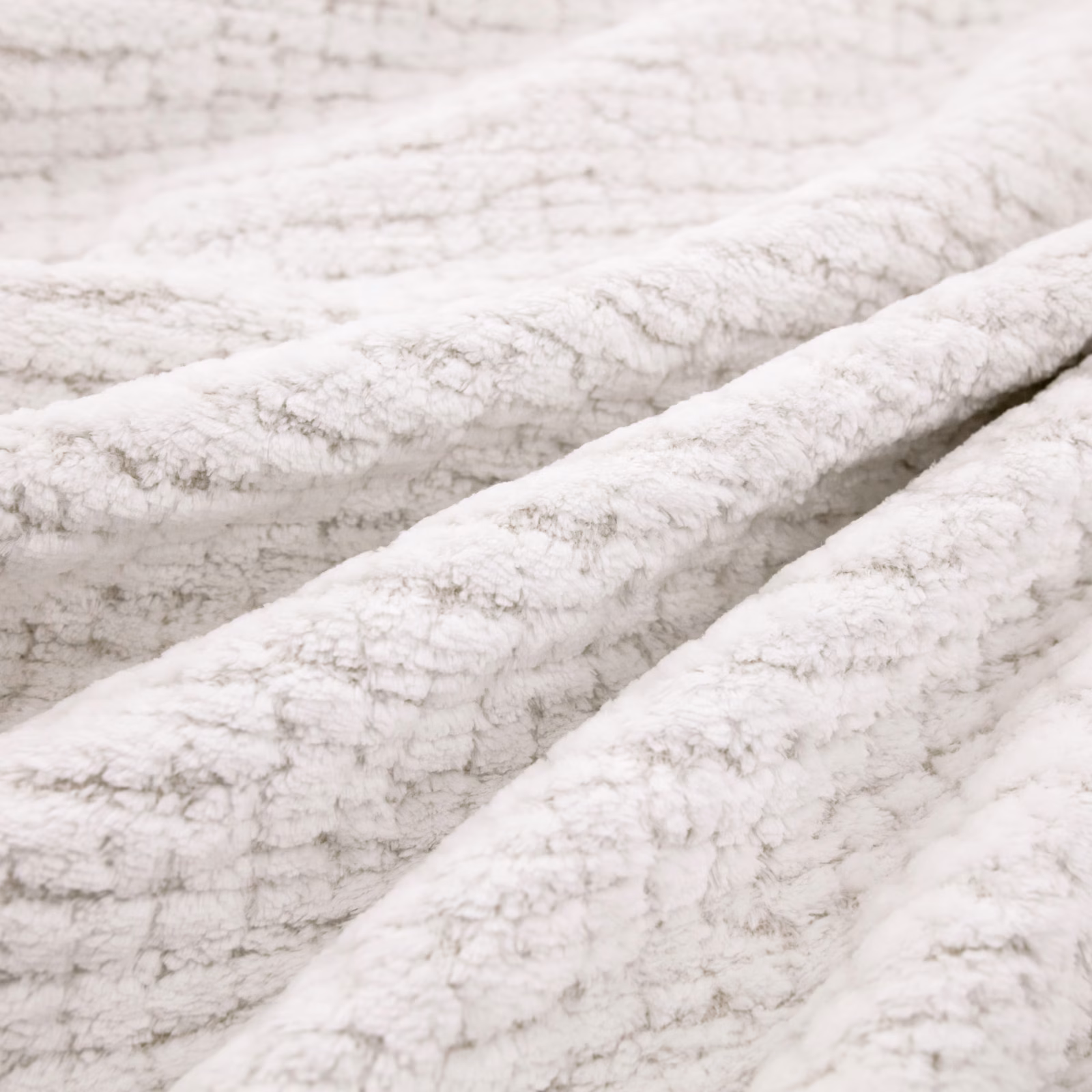 Plush snow-white upholstery with pale grey flecks and a raised nubby texture