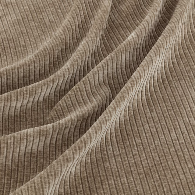 Warm clay taupe fabric with flowing ribbed waves and layered brown tonal texture