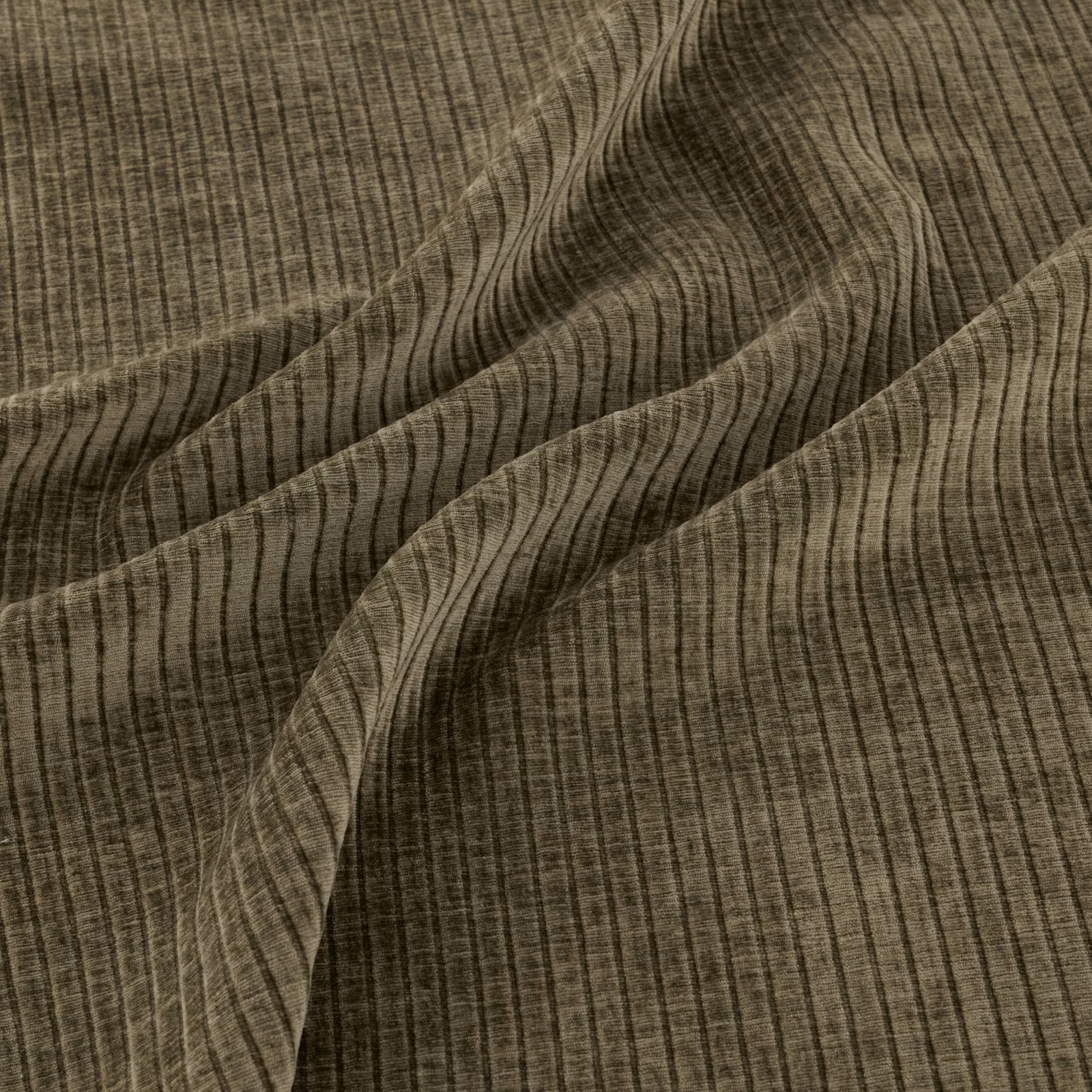 Dark olive-green fabric with fine vertical striations and flowing wavy lines