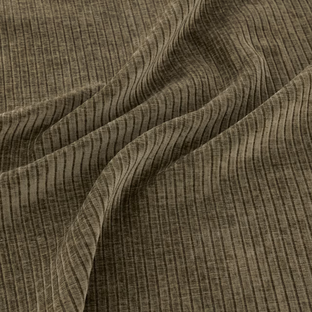 Dark olive-green fabric with fine vertical striations and flowing wavy lines