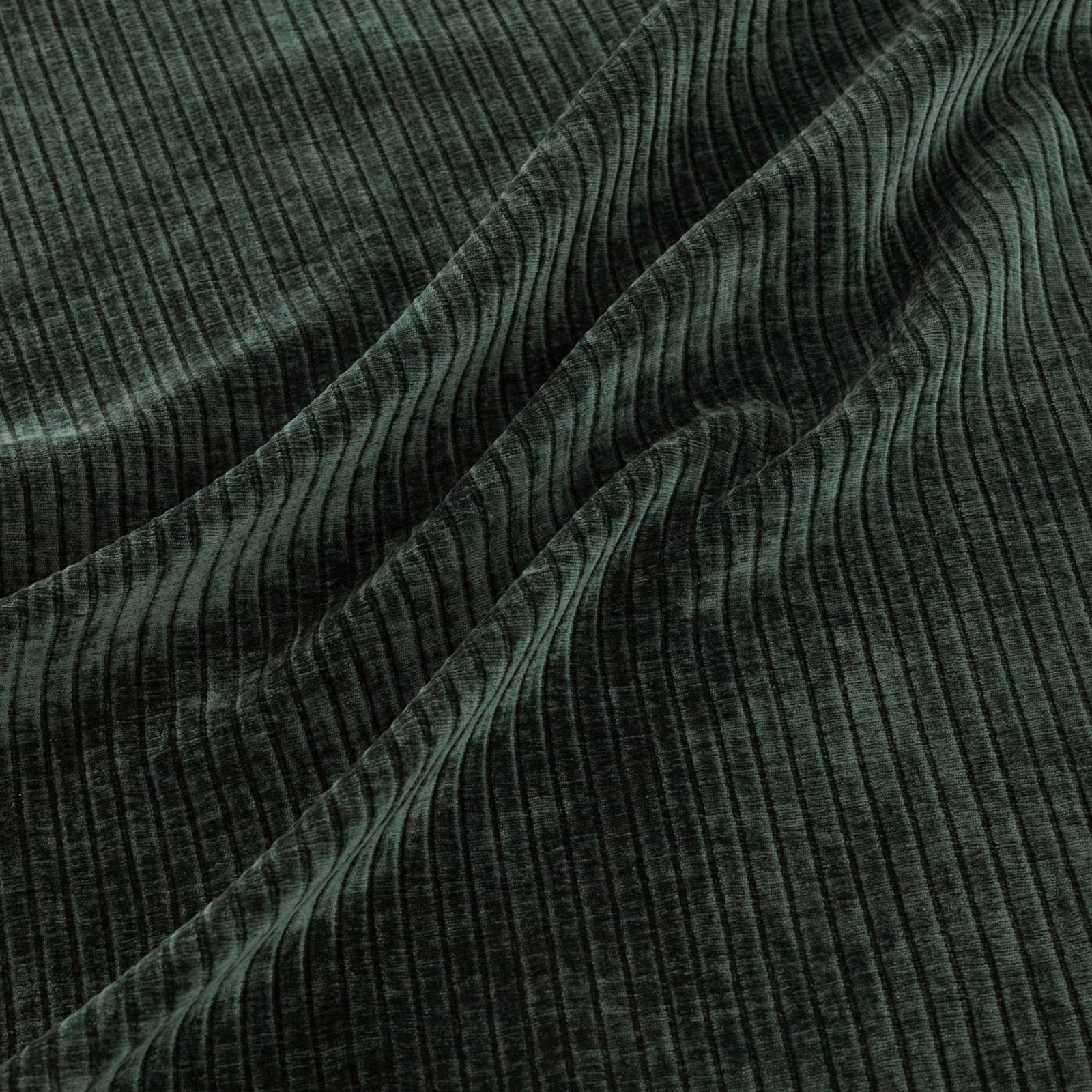 Dark pine-green fabric with vertical ribbing gathered into softly waved folds