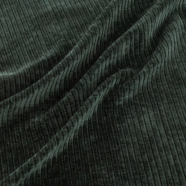 Dark pine-green fabric with vertical ribbing gathered into softly waved folds