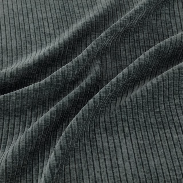 Deep teal ribbed fabric with fine vertical lines and sweeping curved bands