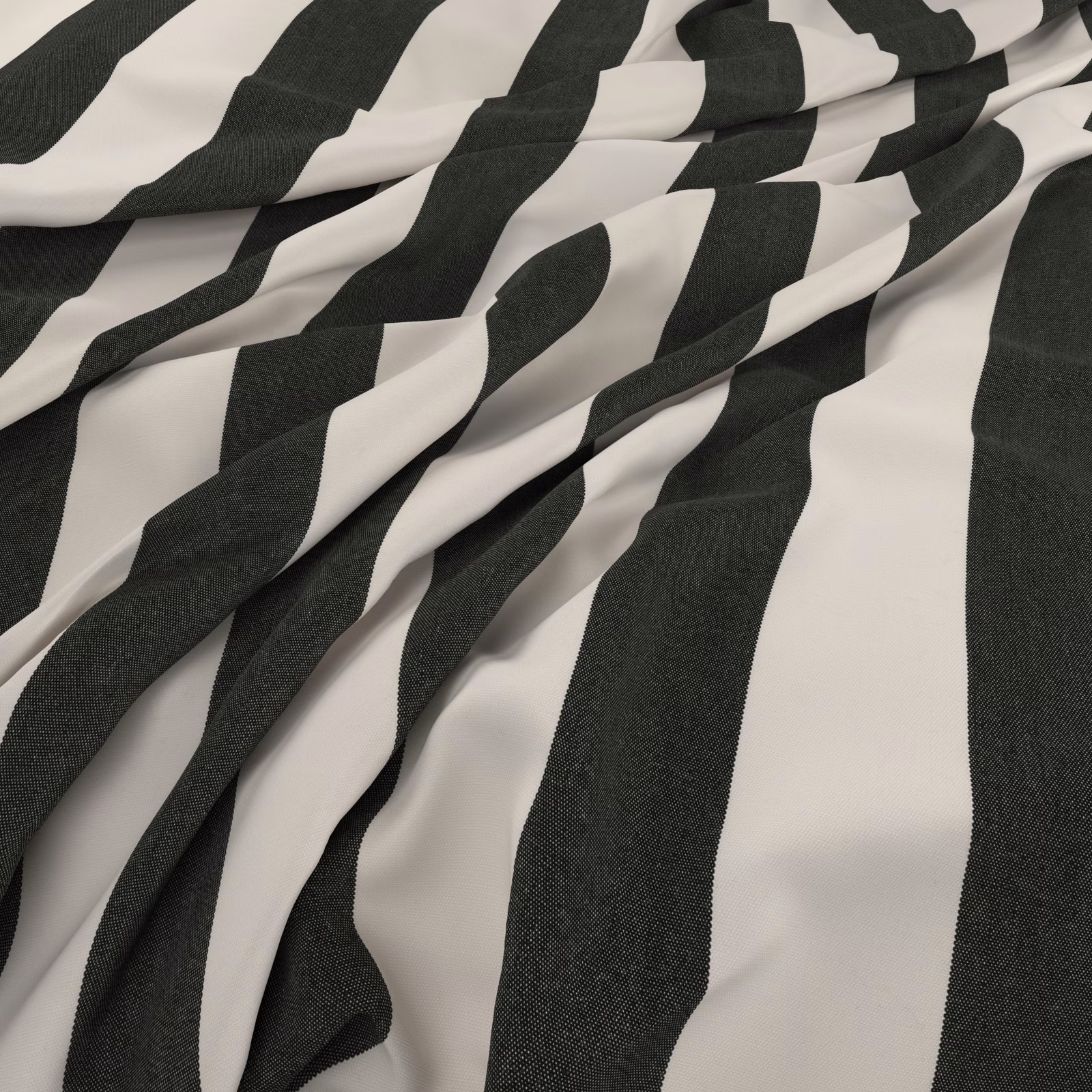 Charcoal and ivory irregular striped fabric shown in soft, dimensional folds