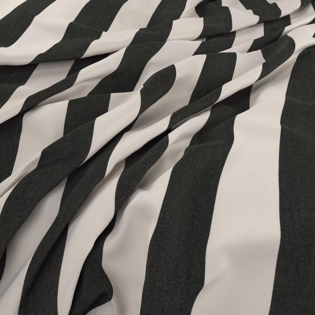 Charcoal and ivory irregular striped fabric shown in soft, dimensional folds