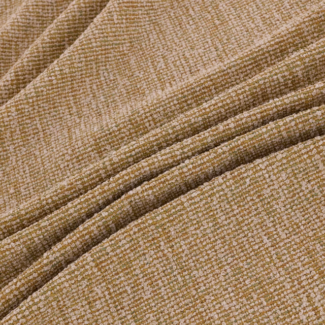 Warm amber-beige woven textile with nubby loops and folded ridges