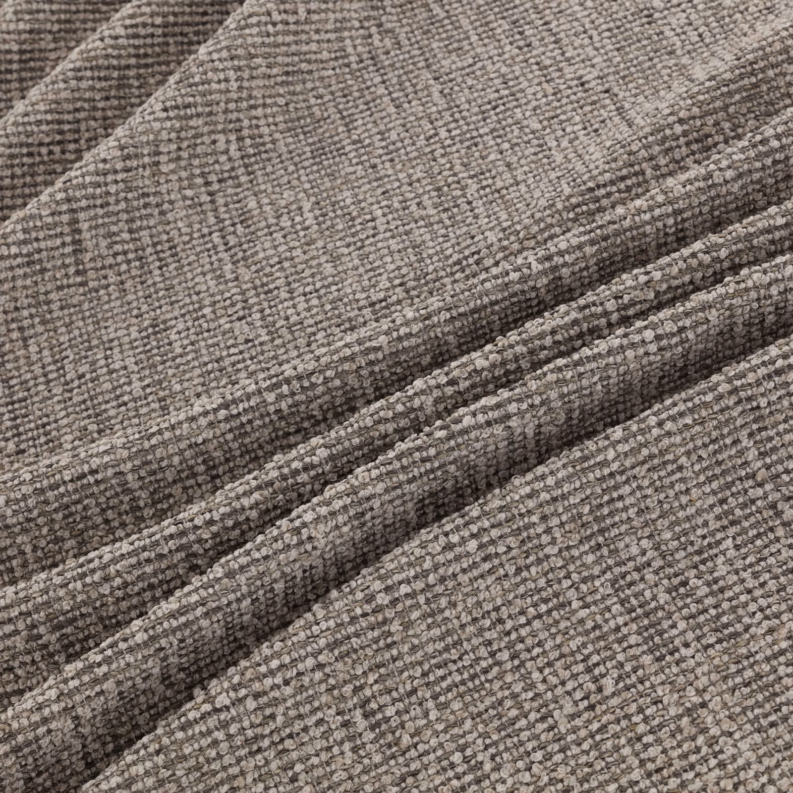 Close-up of taupe-grey Rimini Basalt with dense nubby woven texture