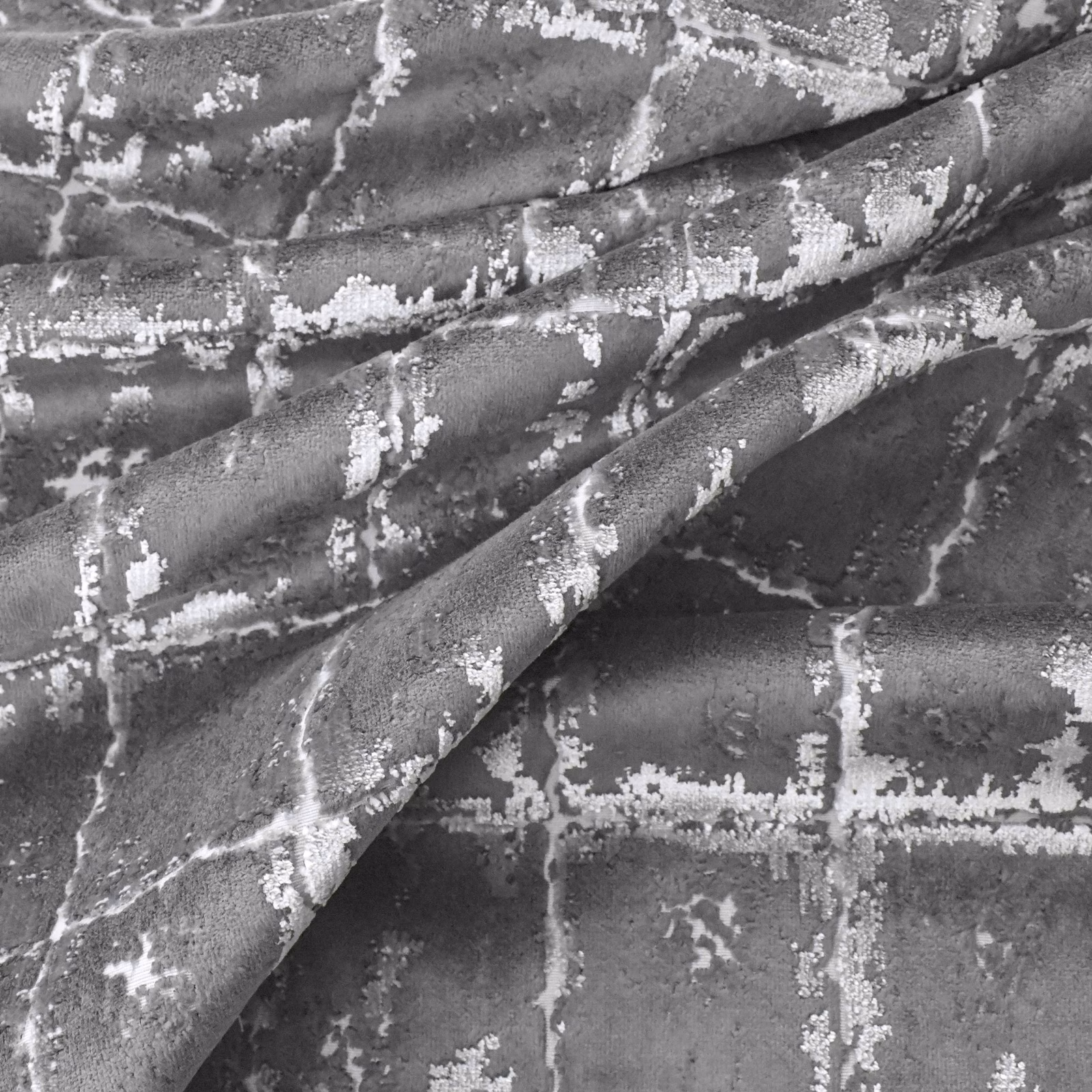 Charcoal grey velvet-like textile with pale silver crackle and grid-like markings