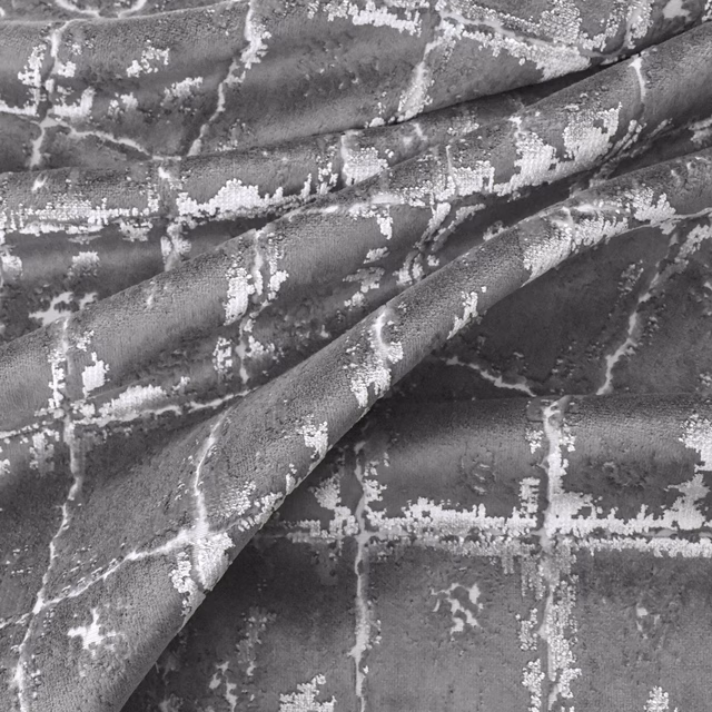 Charcoal grey velvet-like textile with pale silver crackle and grid-like markings