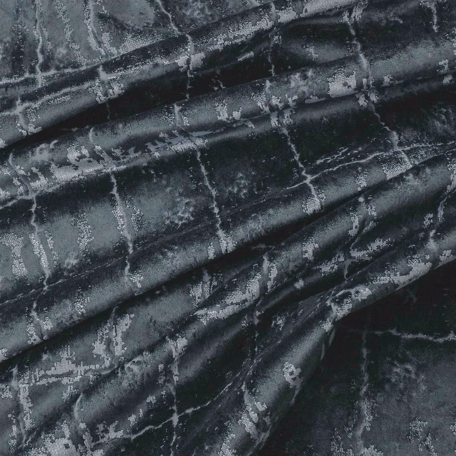Dark petrol fabric with silver-grey distressed markings and glossy gathered folds