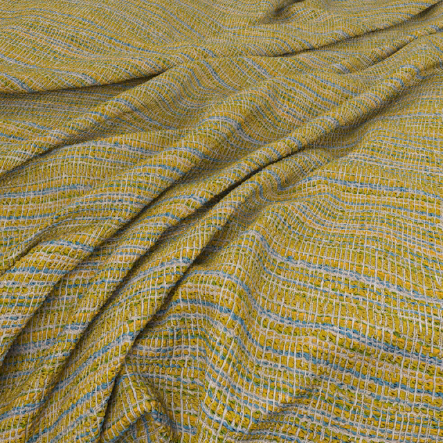 Yellow-olive woven swatch with pale blue-grey ripples and raised tactile texture
